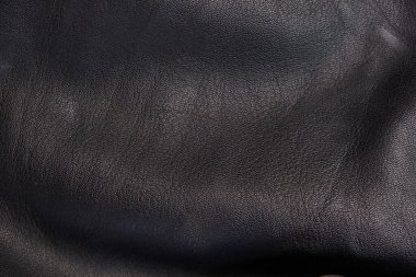 Siyah deri dokuları pürüzsüz. Katların yüksek çözünürlüklü dokusu. Siyah dana derisi.