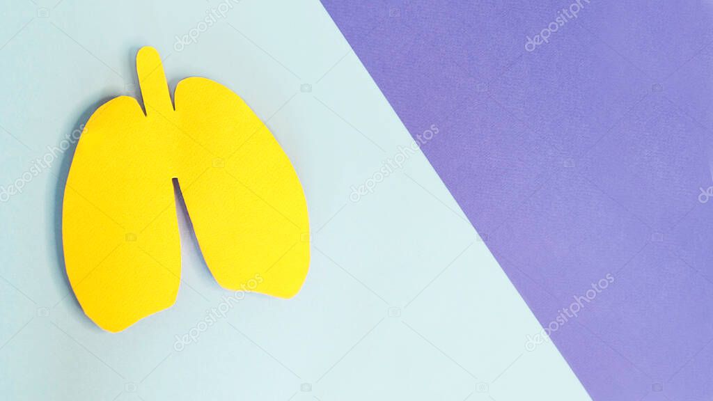 Lung health therapy medical concept. silhouette of yellow paper lungs on blue background. concept of respiratory disease, pneumonia, tuberculosis, bronchitis, asthma, lung abscess