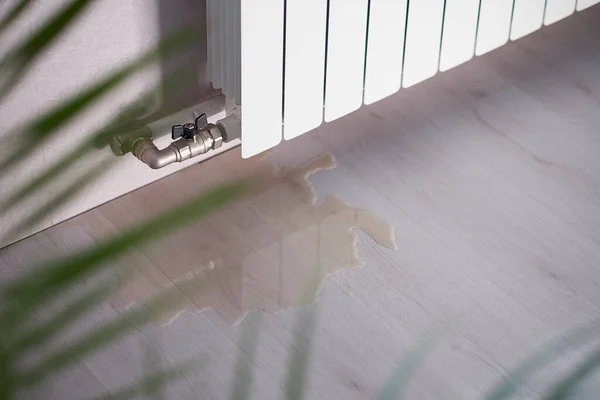 Water leak through the heating radiator tube nut. water leaking from the valve — Stock Photo, Image