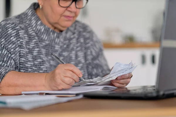 Old people, tax return and home banking. Worried senior lady paying federal taxes, doing family budget. Elderly hispanic person and stress. Concept of money, finance, financial problems