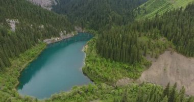 Aerial view of the Kayindy mountain lake with trees