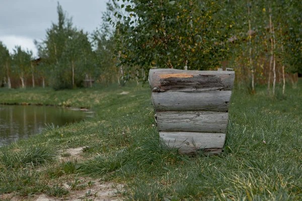 A trash can of the boards in the nature.