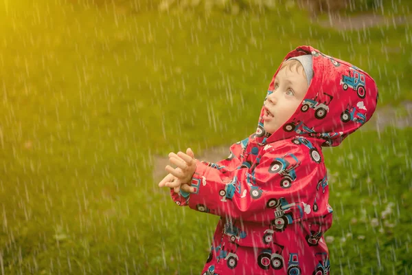 Little Boy Waterproof Jacket Tractors Catch Rain Child Having Fun — Stock Photo, Image