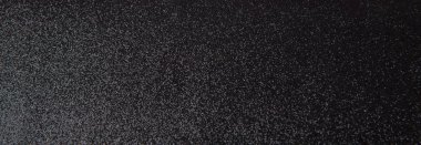 Gümüş pullu desen. Arka plan olarak siyah yün kumaş üzerine parlak pullu.