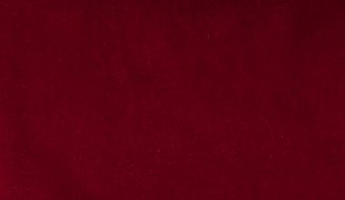 Kırmızı kadife kağıt kabartma çiçeklerle yakın çekim.