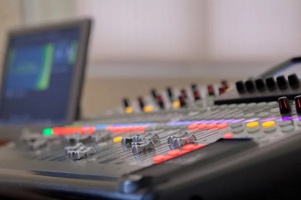Sound recording studio mixing desk. Music mixer control panel.