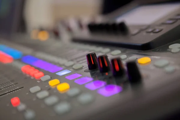 Sound recording studio mixing desk. Music mixer control panel.