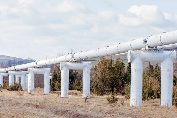 Close-up Metal pipes in the field. pipes from the pipeline. gas pipeline for gas pumping. heat-pipe. large silver colored pipe for hot water