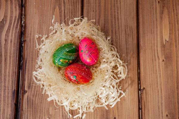 Colorful Easter eggs on wooden background with copy space — Stock Photo, Image