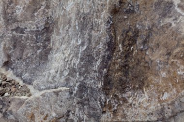 Gri bej taş doku. Rock. Taş arka plan. Kabartma yüzey. Uçakta güzel doğal desen. Raster görüntüye