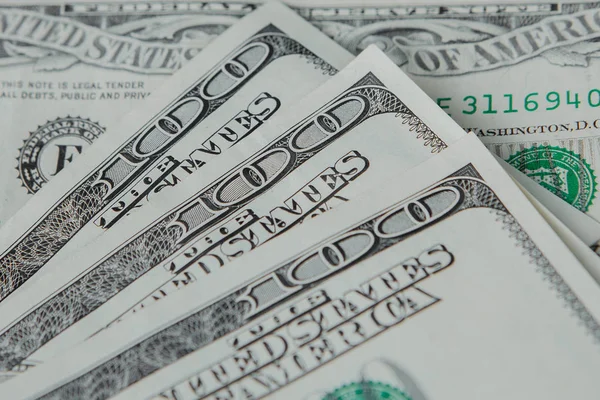 Close-up american dollar banknotes against the background of dollars