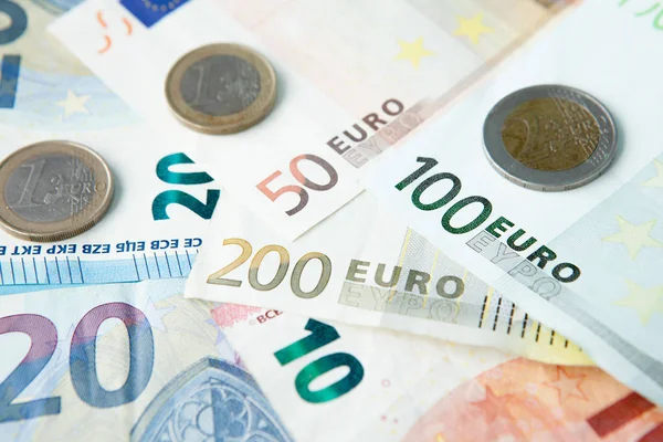 Euro banknotes and coins background . Money and finances concept.