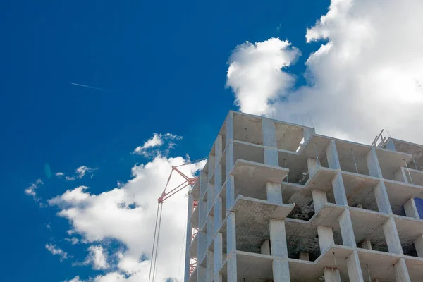 High-rise multi-storey buildings under construction. Tower cranes near building. Activity, architecture, development process, skyscraper — Stock Photo, Image