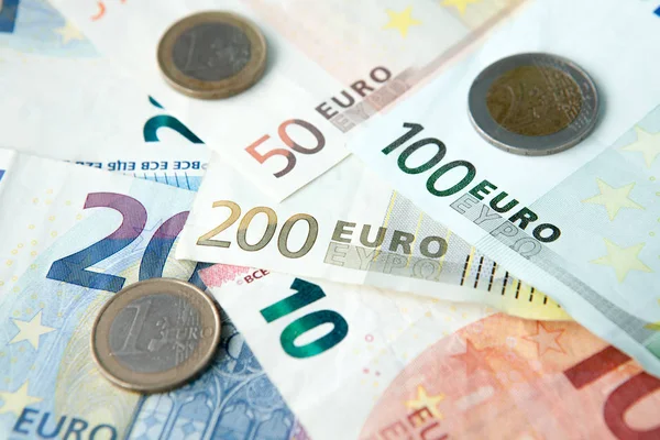 Euro banknotes and coins background . Money and finances concept.