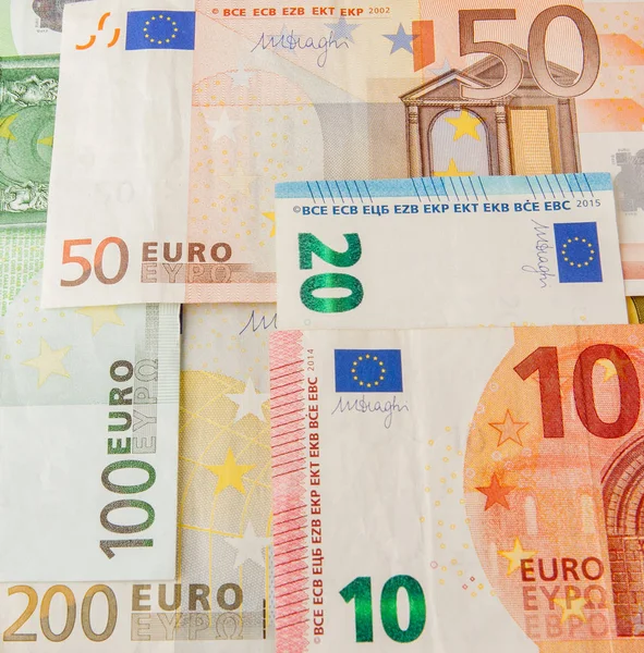 Euro peníze. Euro pokladní pozadí. Euro bankovky peníze. Pozadí z různých eurobankovek zblízka — Stock fotografie