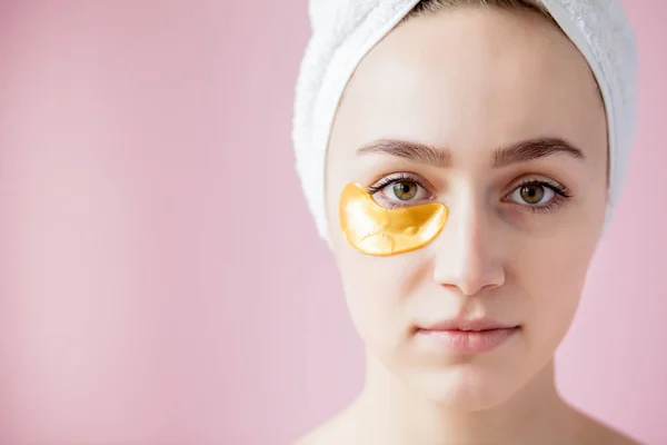 Portrait of Beauty Woman with Eye Patches on pink background. Wo