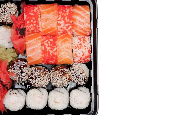 Duży zestaw Sushi IB czarne plastikowe pudełko na białym tle, widok z góry — Zdjęcie stockowe