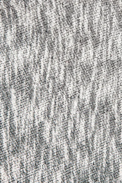 Véritable tissu tricoté gris bruyère en fibres synthétiques fond texturé — Photo