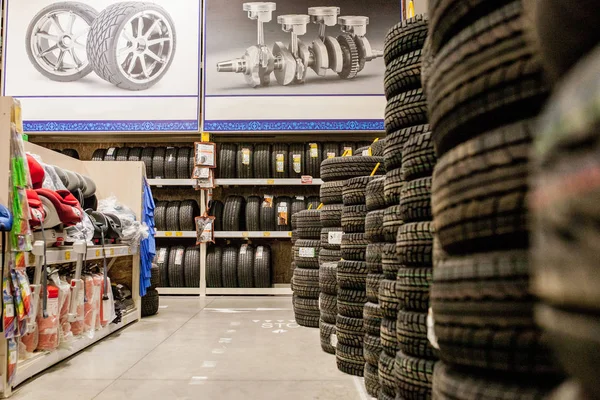 KYIV- JAN 6, 2019: Car tires and wheels at warehouse in tire store. — Stock Photo, Image