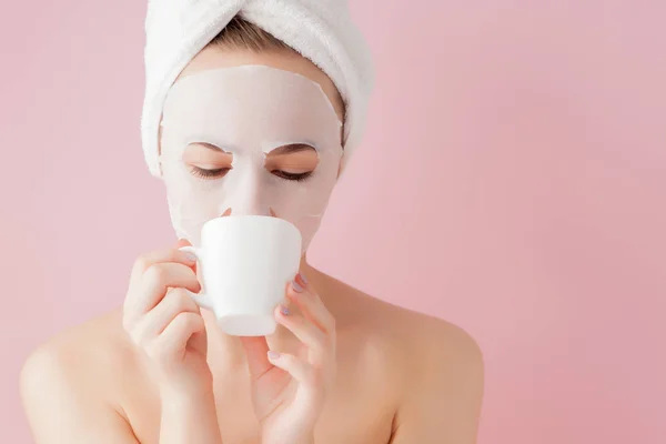 Portrait of beautiful girl in bathrobe with a cup of tea, relaxation concept blonde woman wearing bathrobe and towel on head after shower. Spa woman in bathrobe and turban — Stock Photo, Image