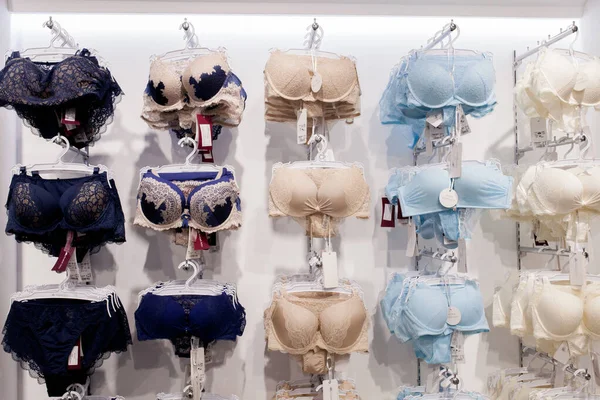 Female lingerie store showcase. Bras on hangers. High-quality women  underwear boutique. Different styles and patterns of bras. Attractive  romantic and home clothes shop. Stock Video Footage by ©artiemedvedev  #325115234