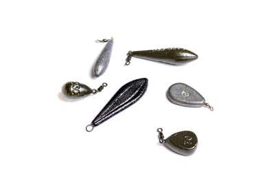 The set of lead fishing sinkers isolated on the white background clipart