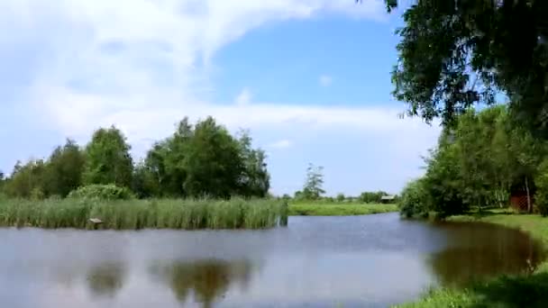 Time Lapse Fishing Lake Bright Blue Sky Blowing White Clouds — Stock Video