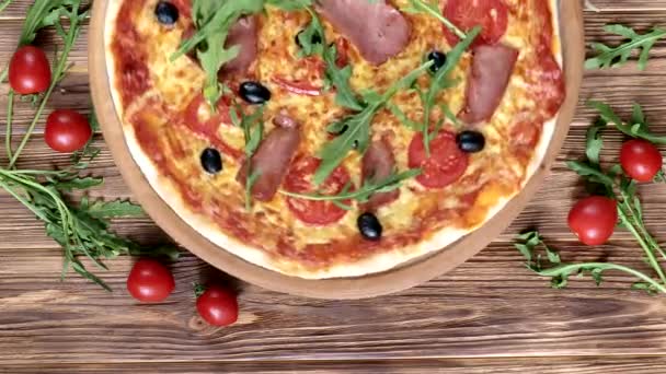 Italian Pizza Ham Tomatoes Olives Basil Wooden Table Top View — Stock Video