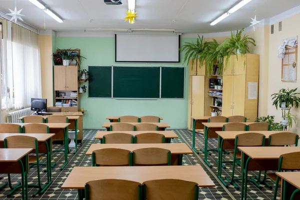 selective soft and blur focus.old wooden row lecture chairs in classroom in poor school.study room without student.concept for education.