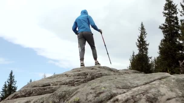 Young Carefree Boy Climbing Solid Huge Rocks Using Poles Make — Stock Video