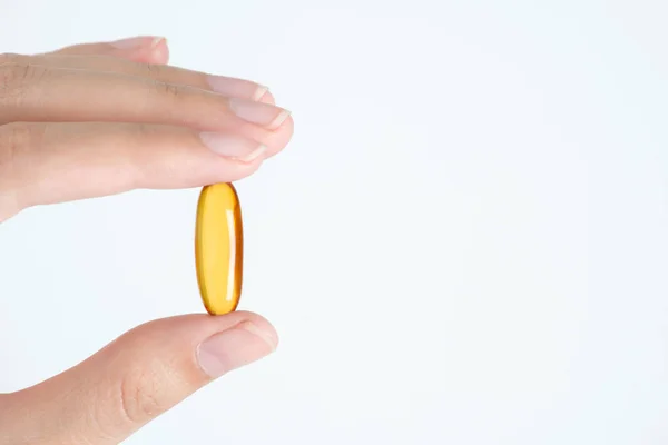 Closeup Woman Hand Showing Fish Oil Capsules — Stock Photo, Image