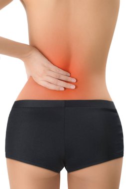 mükemmel sağlıklı vücut şekli poz ve onu geri ağrı alanda vurgulanır kırmızı ile Masaj, beyaz arka plan üzerinde izole kadın.