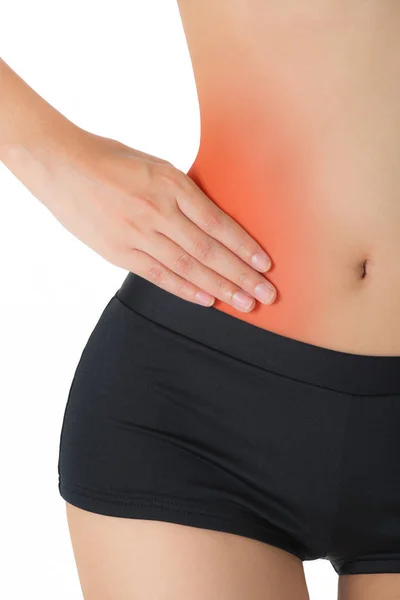 妇女塑造完美健康的身体形状和按摩她的腰部疼痛地区与红色突出 孤立的白色背景 — 图库照片