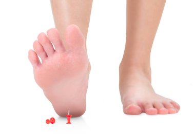 front view of woman's feet stepping on the red push pin, unforeseen concept, Isolated on white background. clipart