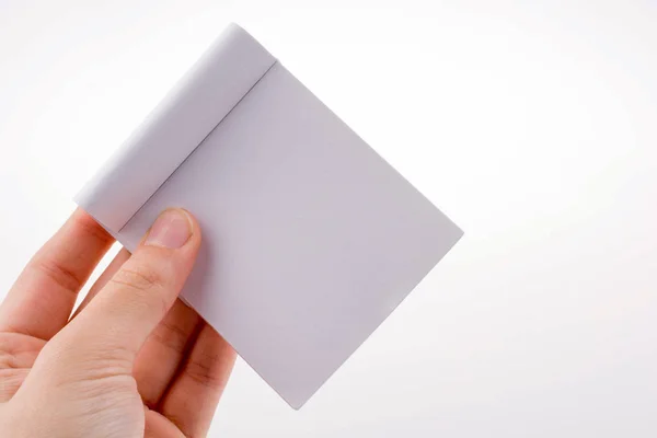 Cuaderno Blanco Mano Sobre Fondo Blanco — Foto de Stock