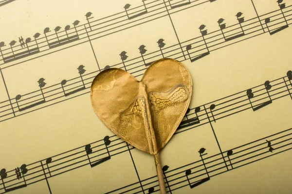 Music notes and heart shaped icon