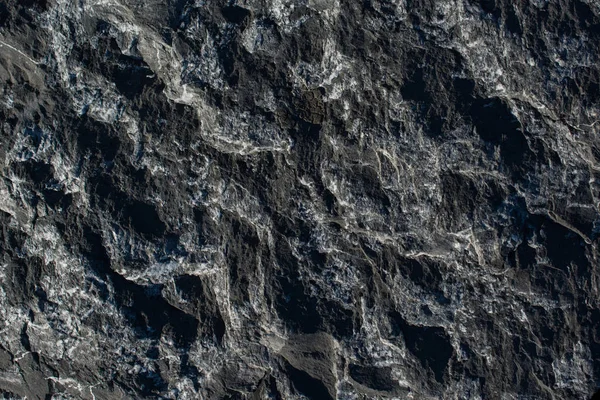 Doğal kaya, arka plan dokusu olarak taş yüzeyi.