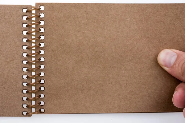 Mano Sosteniendo Cuaderno Espiral — Foto de Stock