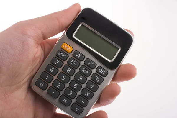 Hand Met Een Rekenmachine Een Witte Achtergrond — Stockfoto