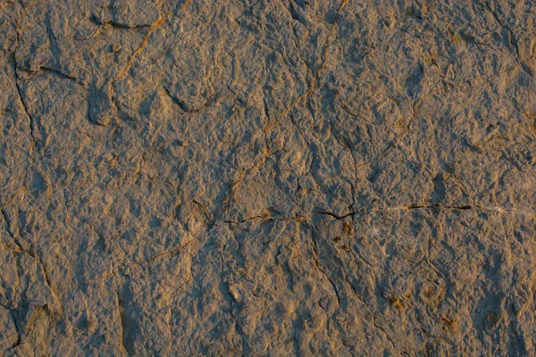 Arka plan dokusu olarak doğal kaya veya taş yüzeyi