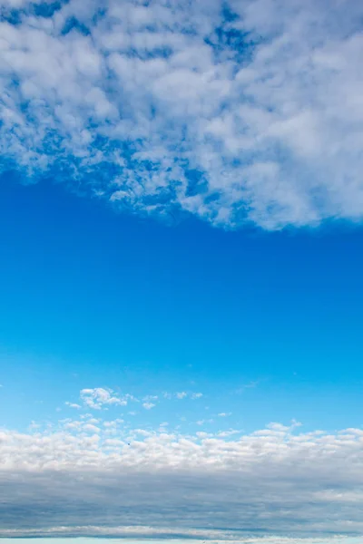 White color clouds found in the  blue sky background