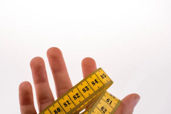 Person Holding Yellow Measuring Tape — Stock Photo, Image