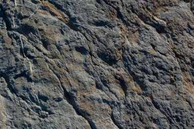 Doğal kaya, arka plan dokusu olarak taş yüzeyi.