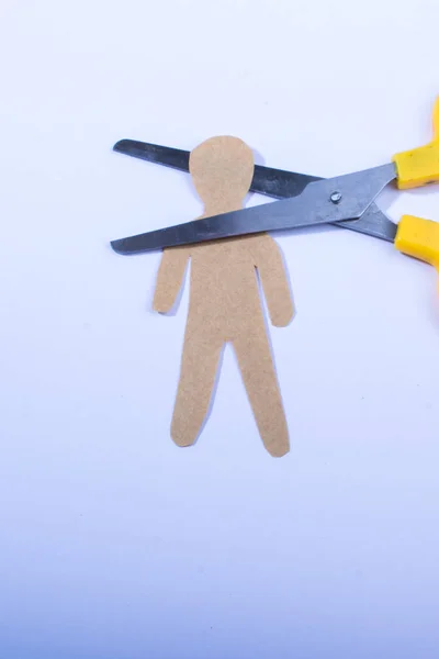 Man shape cut out of paper in hand in the view