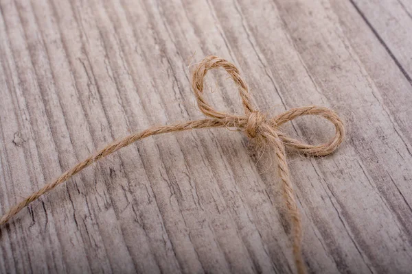Thread tied  as knot on a light color background