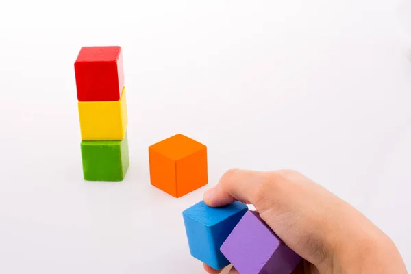 Hand playing with cubes — Stock Photo, Image