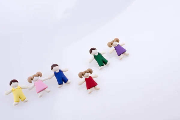 Figuras Crianças Vestidas Coloridas Fundo Branco — Fotografia de Stock