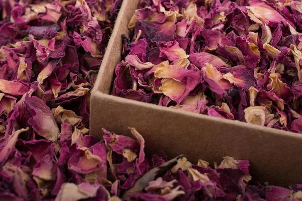 Dried  rose petals in box and as a background