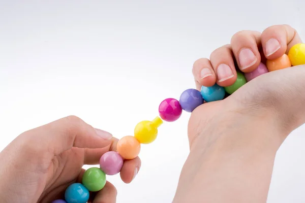 Hand Holding Color Beads Facial Expression White Background — Stock Photo, Image