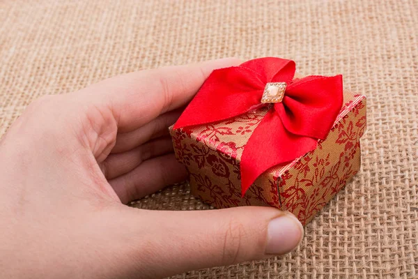 Gift Box Red Ribbon Made Cardboard Hand — Stock Photo, Image